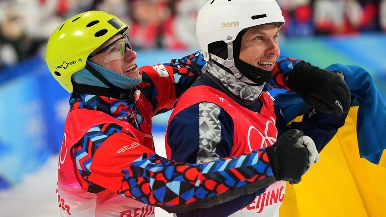 أولمبياد بكين تجمع روسيا وأوكرانيا بعناق حار