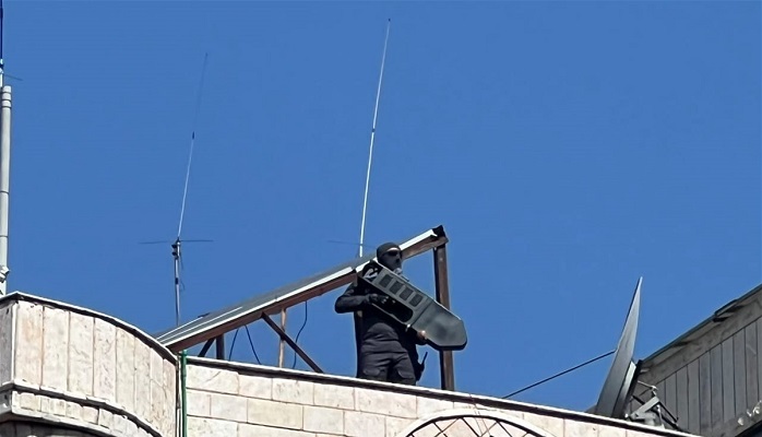 بالصور.. “قناصة حزب الله” تنتشر على المباني في الضاحية